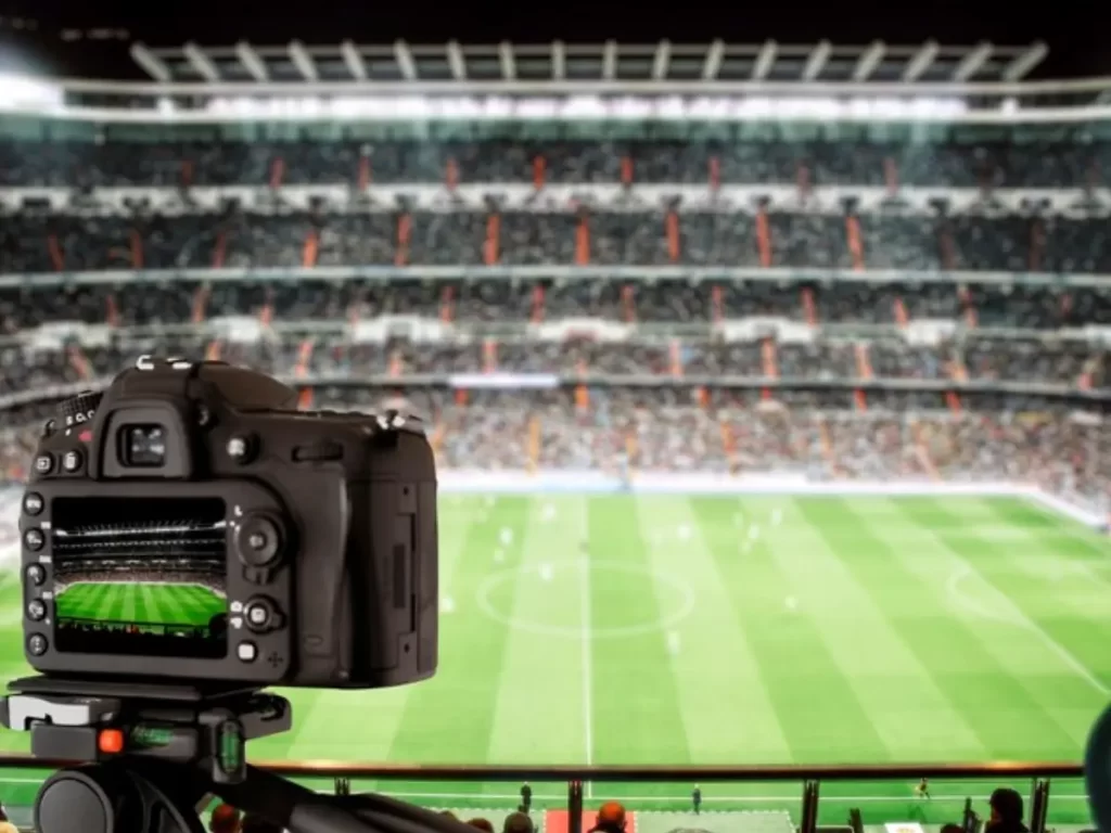 câmera gravando a partida de futebol